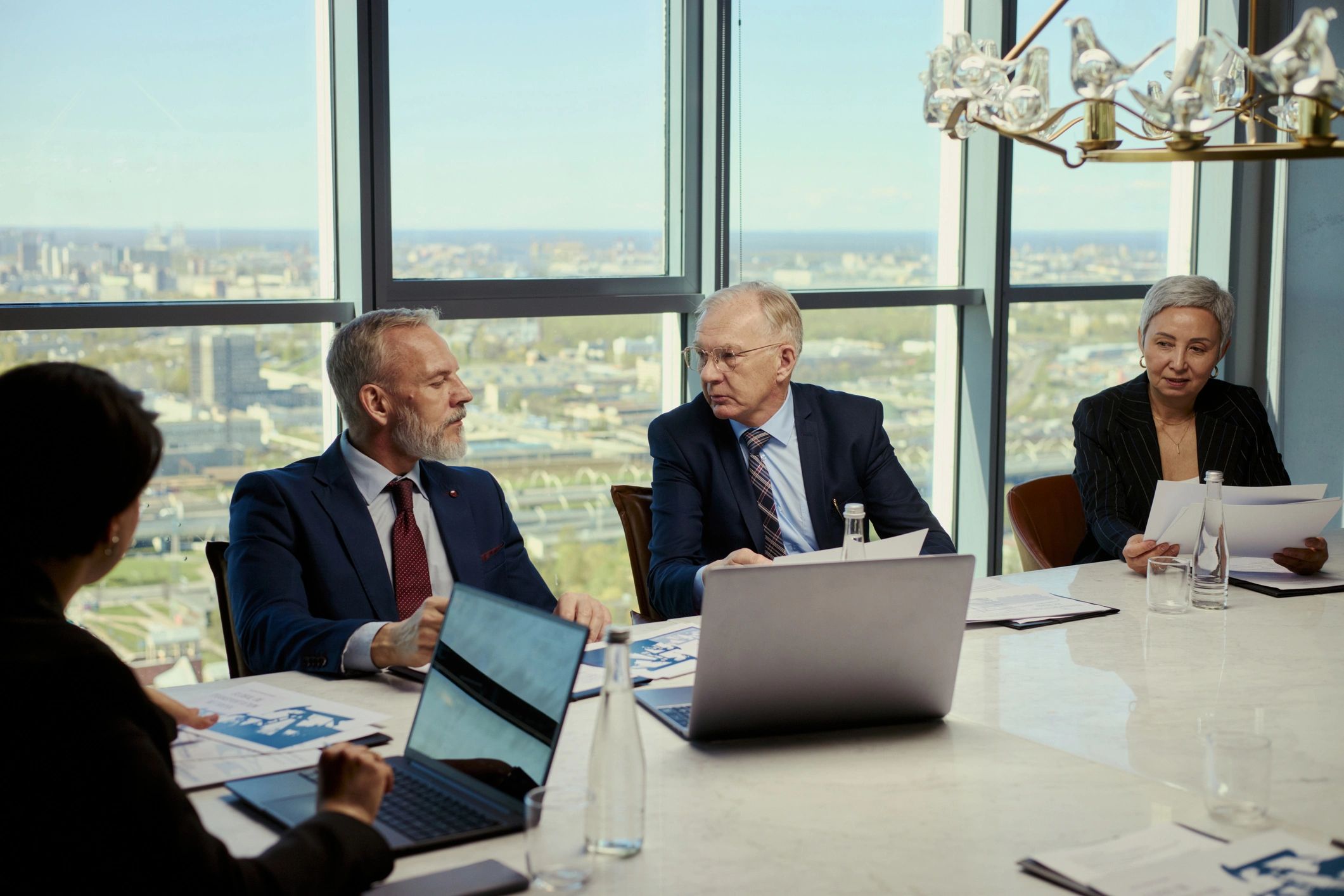 Senior team discussing strategy in a professional meeting